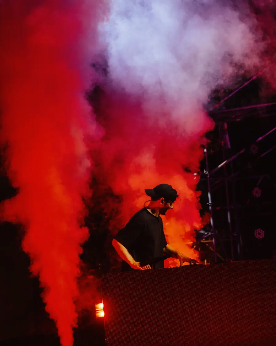 Daniel Grunenberg performing behind the DJ booth